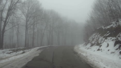 A-car-moves-along-a-mountain-road