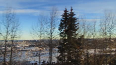 View-of-snowy-countryside-from-moving-train