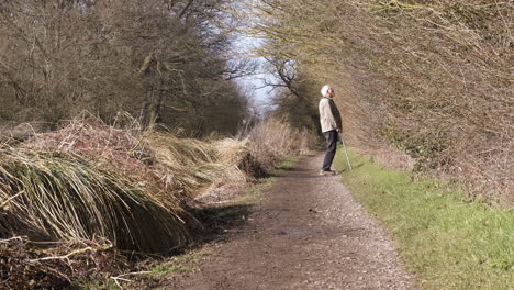 Man-walking-along-the-canal-tow-path