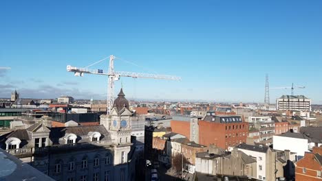 2nd-Paining-shot-over-Dublin-city-south-side-looking-to-the-north,-Construction-crane-on-top-of-buildings