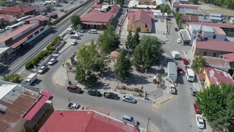 Aerial-orbit-shot-of-the-center-plaza-with-a-kiosk,-Creel,-Chihuahua,-Mexico