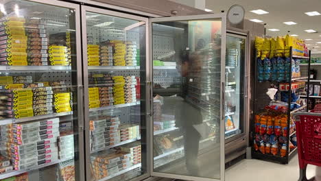 Woman-shopping-for-frozen-pizzas-at-her-local-Target-store
