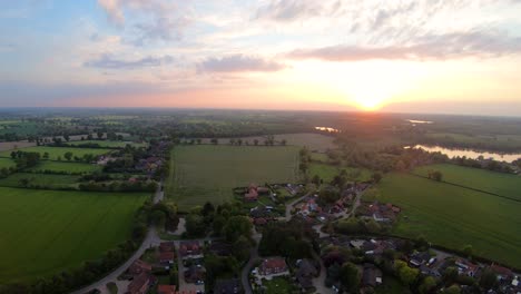 Aerial-Drone-Footage-of-a-sunset-over-the-Norfolk-village-of-South-Walsham