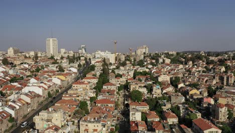Israel,-Jerusalem-neighborhood-red-rooftops-view,-low-forward-fly-over,-aerial-shot