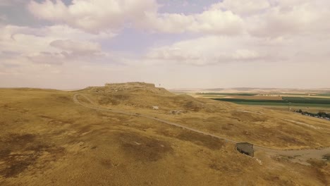 Antiquities-in-the-middle-of-the-Yellow-Desert-with-green-grass-in-the-Background