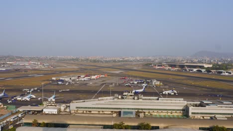Flight-takeoff,-landing---parking-time-lapse-video-at-busy-airport-aerial-view