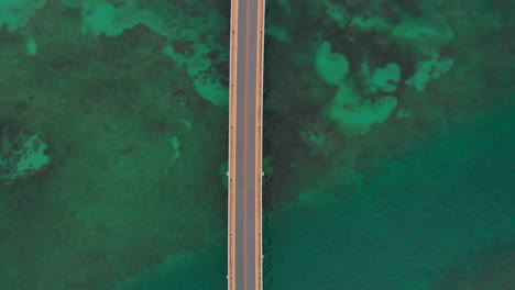 Aerial-view-of-a-bridge-over-coral-reefs-of-the-ocean