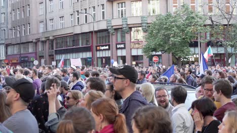 Crowd-of-people-during-demonstration-against-Czech-premier-Andrej-Babis-and-president-Milos-Zeman,-Prague,-Czech-Republic,-side-view