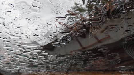 Rain-falling-on-a-flat-glass-sunroof