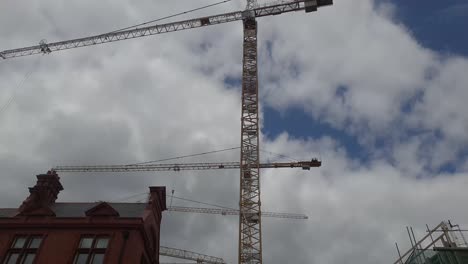Planning-upwards-shot-of-some-building-work-in-the-heart-of-Dublin,-cranes-and-old-buildings