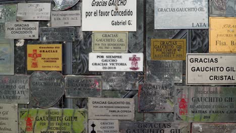 Dedication-plaques-given-by-Gauchito-Gil-believers-for-his-sanctuary-in-Buenos-Aires