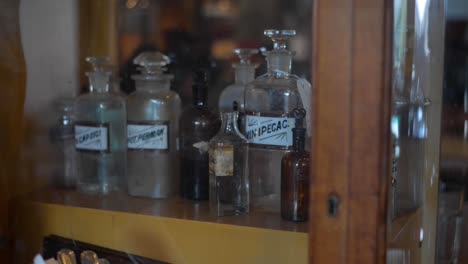 Old-Vintage-Chemistry-bottle-in-a-display-cabinet