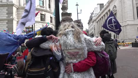 protesters-comfort-each-other-during-the-Extinction-Rebellion-protests-in-London,-UK
