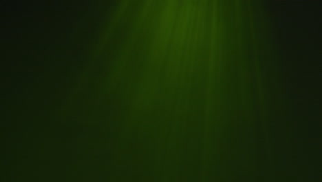 Light-rays-shining-from-above-coming-through-deep-green-water