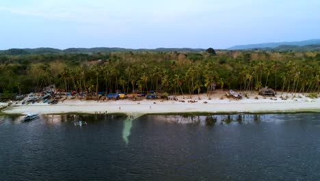 Aerial-pan-along-Paliton-beach-at-sunset,-Siquijor,-Visayas,-Philippines