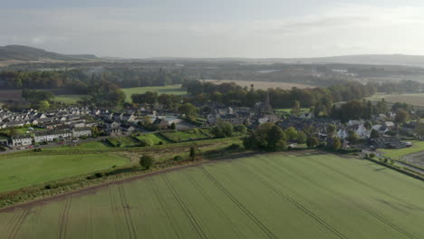 Aerial-view-of-the-Scottish-town-of-Fettercairn-on-a-sunny-Autumn-day,-Aberdeenshire