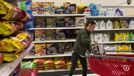 Woman-continues-shopping-after-picking-out-Arm---Hammer-cat-litter-at-Target