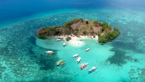Wide-aerial-shot-of-CYC-Island,-Coron-town,-Philippines
