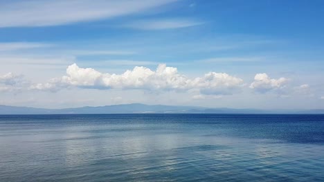 Hyperlapse-of-calm-sea-and-fast-clouds-in-Halkidiki,-Greece