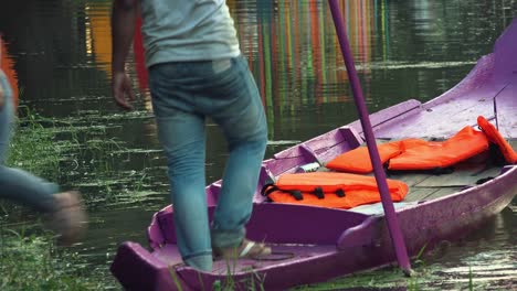 Jumping-out-of-Small-Purple-Boat-on-River