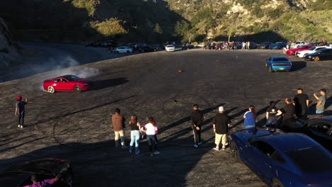 Muscle-and-sports-cars-doing-doughnuts-and-burnouts-with-a-car-club-in-the-Angeles-National-Forest-in-Southern-California