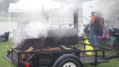 A-BBQ-Pit-smokes-and-steams-during-a-rainstorm-at-a-BBQ-Competition