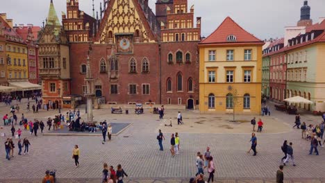 European-city-square,-old-town-hall-Wroclaw,-Pan-time-lapse