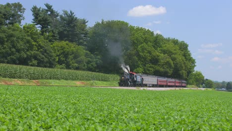 A-Time-Lapse-of-a-1910-Steam-Engine-with-Passenger-Train-Waiting-Along-the-Amish-Countryside-on-a-Sunny-Summer-Day