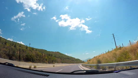 Timelapse-footage-from-car-dashboard-at-Moreas-Highway-located-at-Peloponnese,-Greece