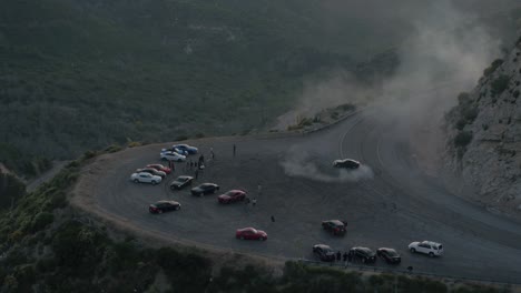 Done-shot-of-muscle-and-sports-cars-doing-doughnuts-and-burnouts-with-a-car-club-in-the-Angeles-National-Forest-in-Southern-California-during-Sunset