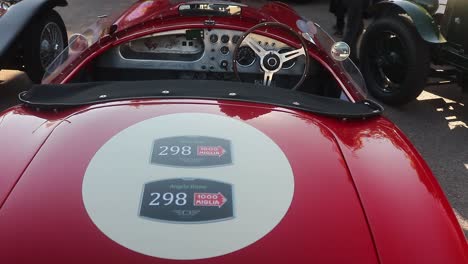 Panning-Right-Shot-of-the-Cockpit-of-Nineteen-Fifty-Four-Mille-Miglia-AC-Ruddspeed-Ace-on-Rob-Walker-Day-Display