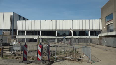 Panning-shot-of-the-exterior-of-congress-center-and-concert-venue-MECC-in-Maastricht,-the-Netherlands,-showing-renovation-works