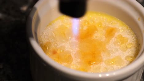 Burn-portion-of-french-dessert-cream-brulee-in-close-up-4K