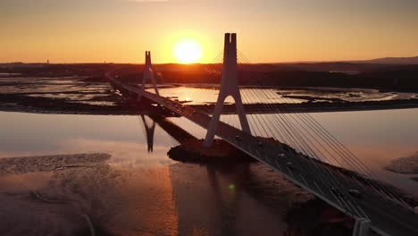 Aerial-view,-locked-down-of-Bridge-at-the-sunset