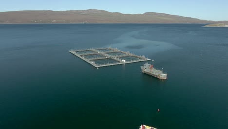 An-aerial-view-of-an-aquaculture-installation-on-Loch-Eriboll-in-the-Scottish-Highlands-on-a-sunny-day