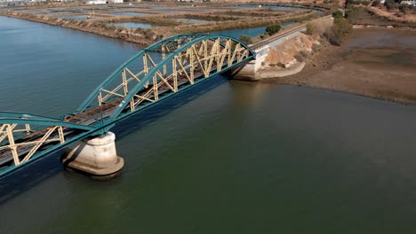 Ariel-view-of-beautiful-bridge-over-river--dolly-out