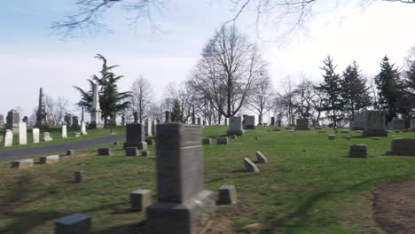 4K:-Driving-slowly-by-rows-of-old-headstones-through-a-cemetery-on-a-beautiful-day
