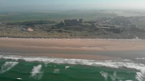 Aerial-view-of-a-castle-on-the-beach-in-Scotland