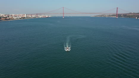 Top-shot-of-a-boat-sailing-on-river-Tejo