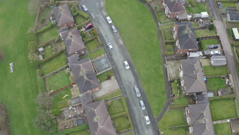 Overhead-view-of-a-council-housing-estate-in-Kidsgrove-Stoke-on-Trent,-flats,-homes-for-the-ever-growing-population,-immigration-and-poorer-areas-of-the-west-midlands,-cheap,-affordable-housing