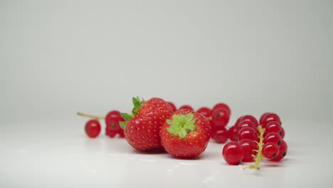 Beautiful-Red-Strawberries-And-Cherries-In-Pure-White-Background---Close-Up-Shot