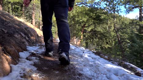 Man-walking-in-mountain-trail-in-slow-motion