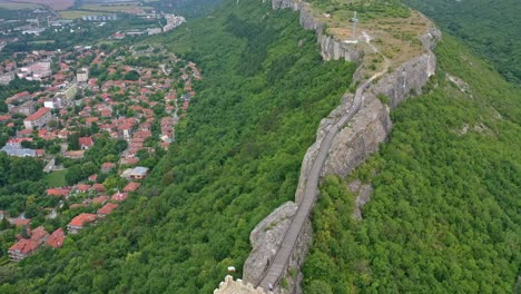 Drone-footage-of-the-ancient-Ovech-fortress-near-Provadia-Bulgaria-surrounded-by-green-trees