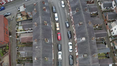 Overhead-aerial-footage-of-terrace-housing-in-one-of-Stoke-on-Trent's-poorer-areas,-poverty-and-urban-decline,-council-and-social-housing,-West-Midlands