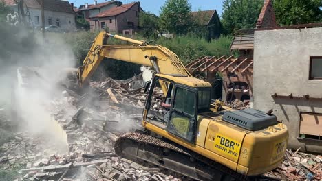 Bulldozer-demolishing-the-old-house