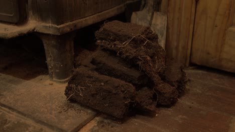 Small-stack-of-dried-turf-beside-stove