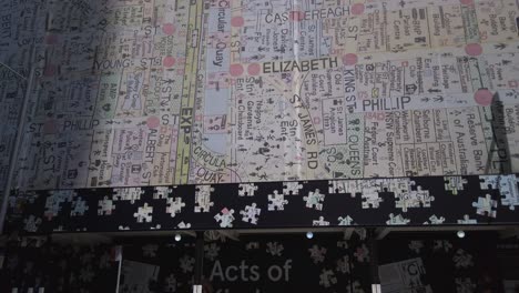Building-under-constructions-covered-with-Act-of-Kindness-wall-art-and-map-of-Sydney-City-CBD