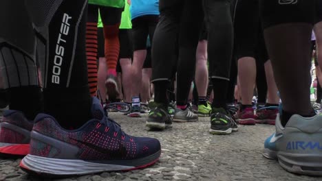 Close-up-of-runner-feet-in-running-shoes-preparing-to-start-a-race
