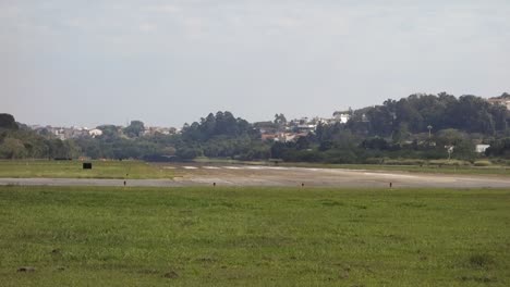 ultralight-airplane-taking-off-from-the-Campo-de-Marte-airport-runway,-in-Sao-Paulo,-Brazil