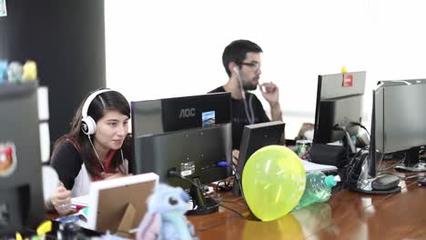 Millennial-tech-savvy-office-workers-at-a-startup-company-on-computers